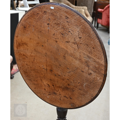 243 - Antique circular oak tilt-top table on tripod base