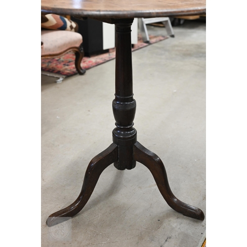 243 - Antique circular oak tilt-top table on tripod base