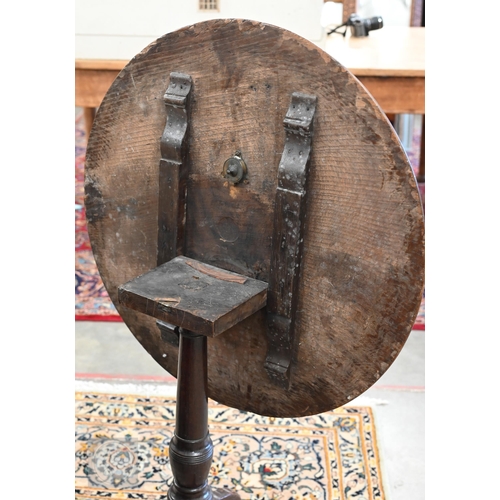 243 - Antique circular oak tilt-top table on tripod base