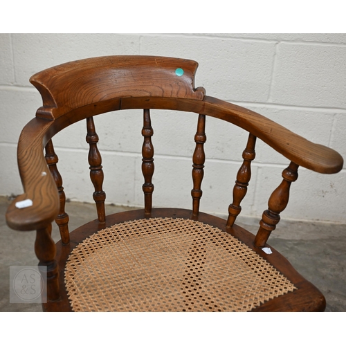 244 - Antique elm Captain's chair with caned seat and turned legs