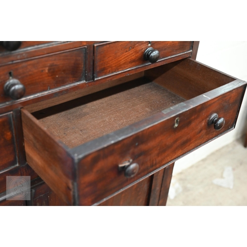 249 - A 19th century mahogany side cabinet with arrangement of eight drawers over panelled cupboards, 100 ... 