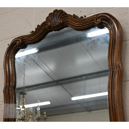 252 - French style wall mirror in moulded hardwood scrolling frame with anthemion crest, 128 x 80 cm