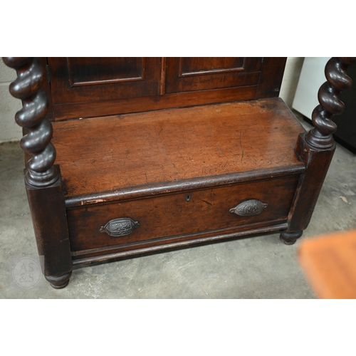 254 - Victorian mahogany slope-top clerk's desk with barley twist pillars, panelled cupboards and single d... 