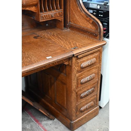 255 - Early 20th century large oak roll-top desk with drawer slide enclosing fitted interior over eight dr... 