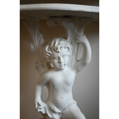 260 - A continental painted open twin-tier side table on cherub pedestal support standing on ornate platfo... 