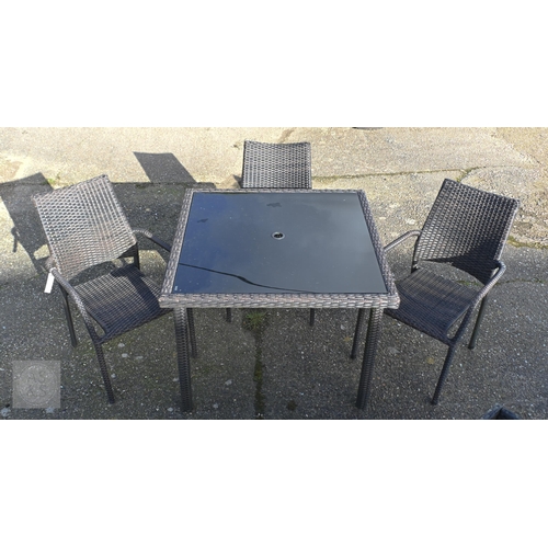 27 - A modern synthetic rattan all-weather smoked glass top garden table and three matching armchairs (4)