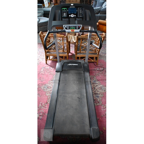 275 - A 'Life Fitness' electronic treadmill, foldable flex-deck, circa 2012 with manual, little used... 