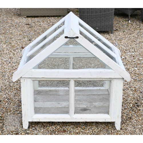 4 - A Victorian style glazed-in cold frame in the form of a greenhouse