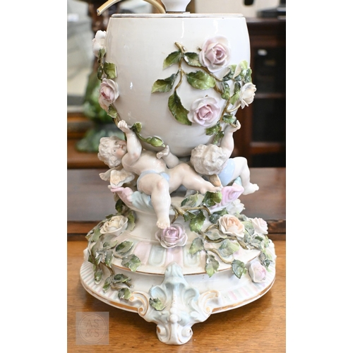 400 - A 19th century Continental porcelain lamp-base with gilt metal mounts and floral painted reserves, 4... 