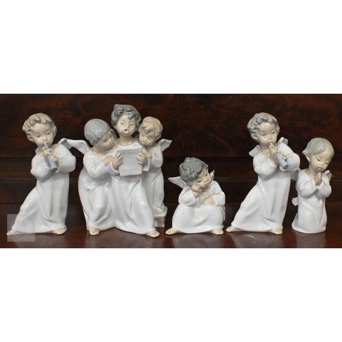 405 - Five Lladro figures/groups of angelic children to/w a goose and a girl with a ukelele latter a/f... 