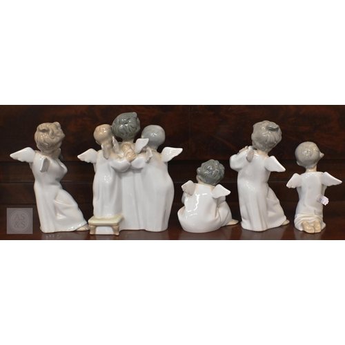 405 - Five Lladro figures/groups of angelic children to/w a goose and a girl with a ukelele latter a/f... 