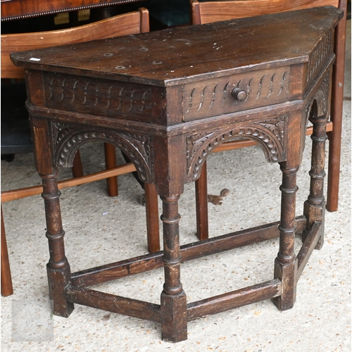 41 - Carved oak hall table with single drawer, with turned supports united by stretchers, 86 x 32 x 72 cm