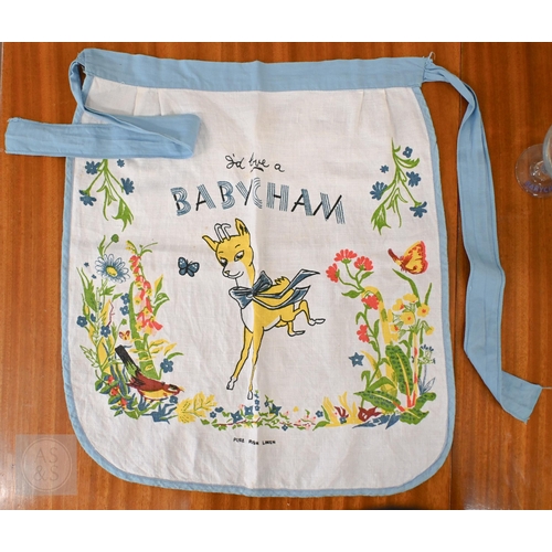 410 - An original boxed Babycham six Glass Party Pack to/w a printed linen Babycham barmaid's apron