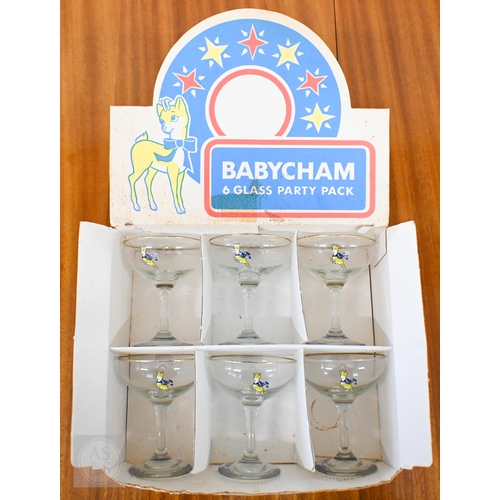 410 - An original boxed Babycham six Glass Party Pack to/w a printed linen Babycham barmaid's apron