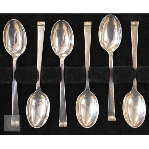 420A - A cased set of six silver teaspoons, Sheffield 1958, to/w five coffee spoons with thistle finials, B... 