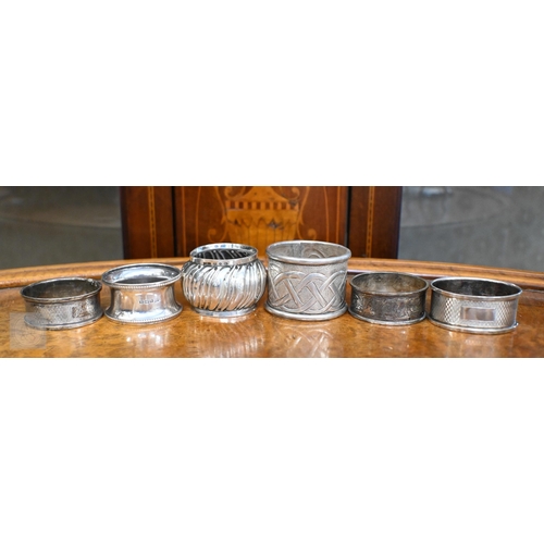 421 - Three boxed pairs of silver napkin rings and two loose examples, 3.5 oz total weight to/w a silver-b... 