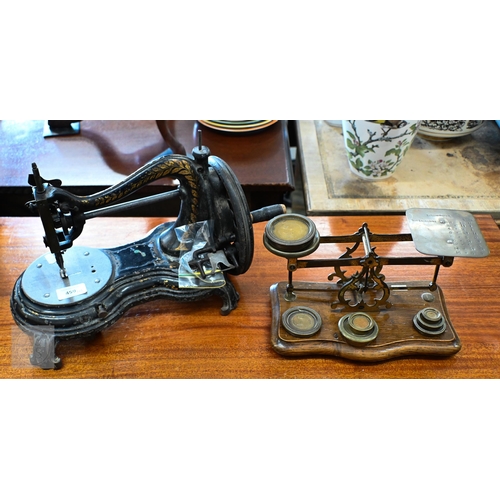 459 - A Victorian Jones & Co. (Manchester) sewing machine, to/w a Victorian oak set of postage scales ... 