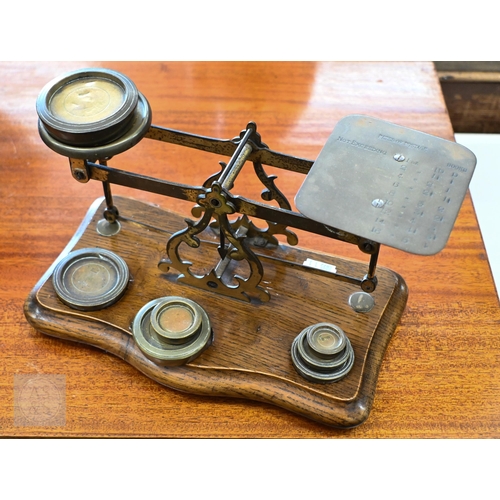 459 - A Victorian Jones & Co. (Manchester) sewing machine, to/w a Victorian oak set of postage scales ... 