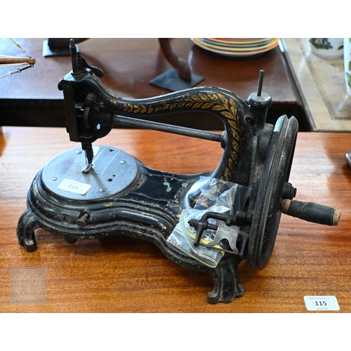 459 - A Victorian Jones & Co. (Manchester) sewing machine, to/w a Victorian oak set of postage scales ... 