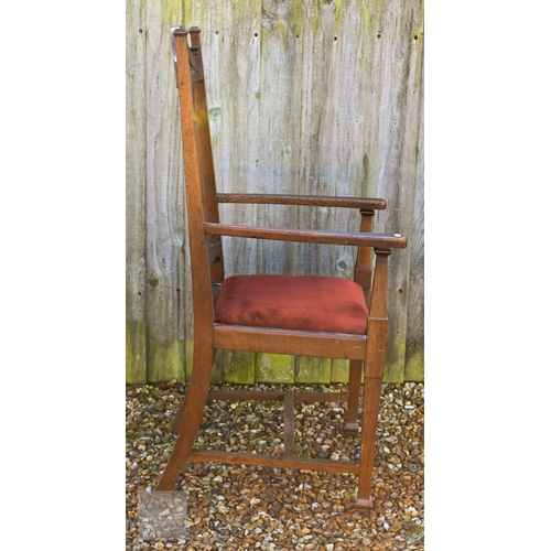 46 - Early 20th century Arts & Crafts carved oak elbow chair