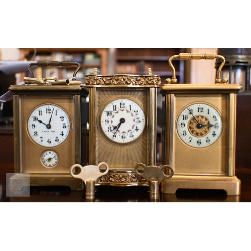 468 - Three brass carriage clocks with enamel dials to/w keys