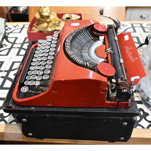 475 - A Harrods-retailed Invicta (Turin) red enamelled portable typewriter, boxed