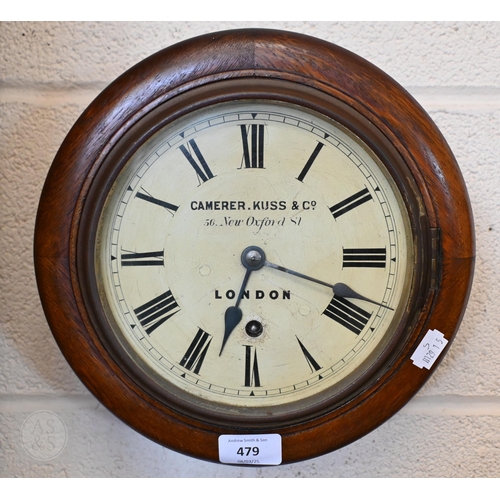 479 - An oak wall clock with 18 cm enamel dial and German movement, by Camerer Kuss & Co, London