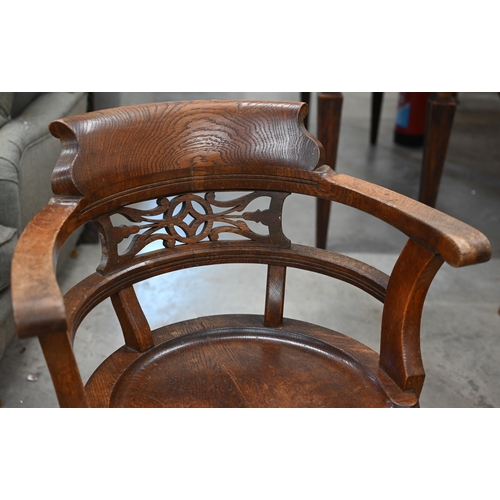 50 - Antique elm and oak Captains style swivel desk chair with fret cut back and four pad footed cabriole... 