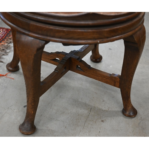 50 - Antique elm and oak Captains style swivel desk chair with fret cut back and four pad footed cabriole... 