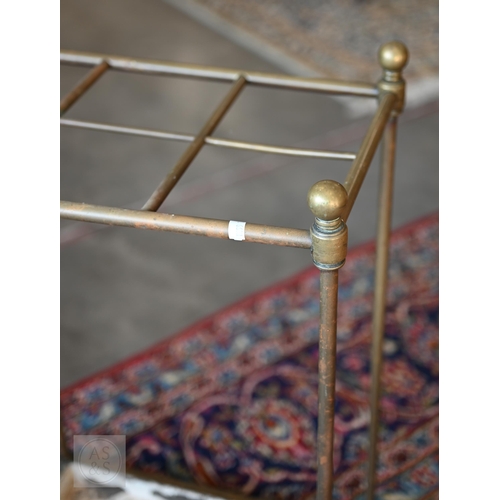 51 - A brass six division unbrella/stick stand with painted drip tray base, 42 x 26 x 65 cm h