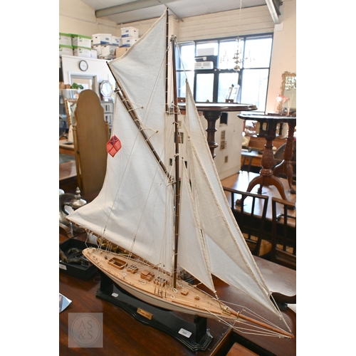 531 - A model J-class yacht 'Tuiga 1909', 92 cm high including stand