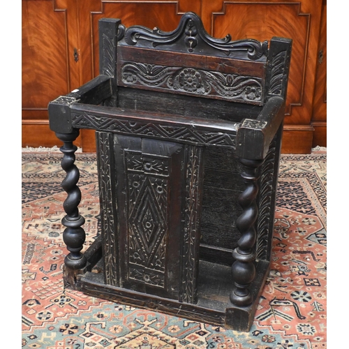 65A - An antique stained oak umbrella stand with barley-twist pillars and carved oak panels, 60 cm w x 36 ... 