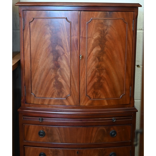 70 - A reproduction bowfront mahogany tall boy drinks cabinet, 62 cm w x 44 cm d x 130 cm h c/w two keys