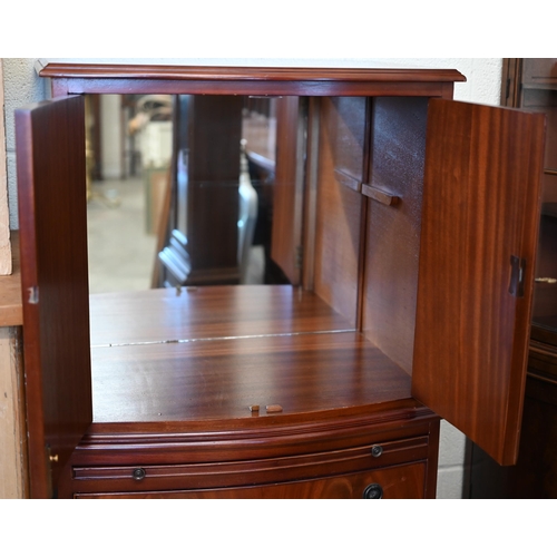 70 - A reproduction bowfront mahogany tall boy drinks cabinet, 62 cm w x 44 cm d x 130 cm h c/w two keys