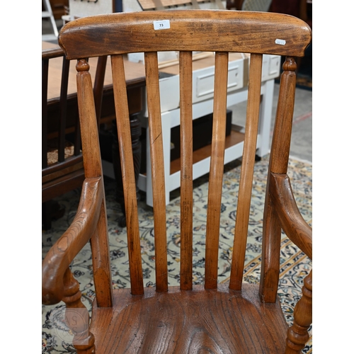 73 - A vintage ash and elm lath back Windsor chair with turned legs and stretchers