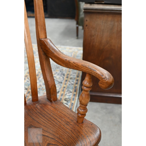 73 - A vintage ash and elm lath back Windsor chair with turned legs and stretchers