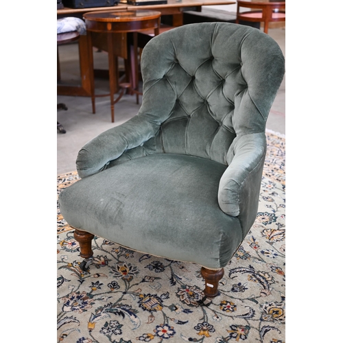 74 - A Victorian nursing chair upholstered with green button back fabric