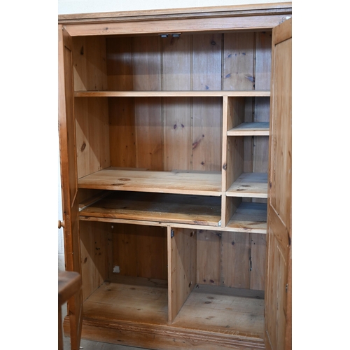 80 - A waxed pine two door media/computer cabinet with fitted interior, 116 cm w x 60 cm d x 164 cm h