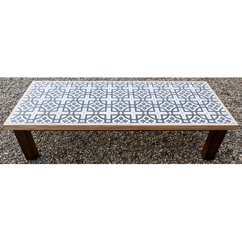 89 - A stained wood rectangular reception coffee table with black and white encaustic style tiled top, 18... 