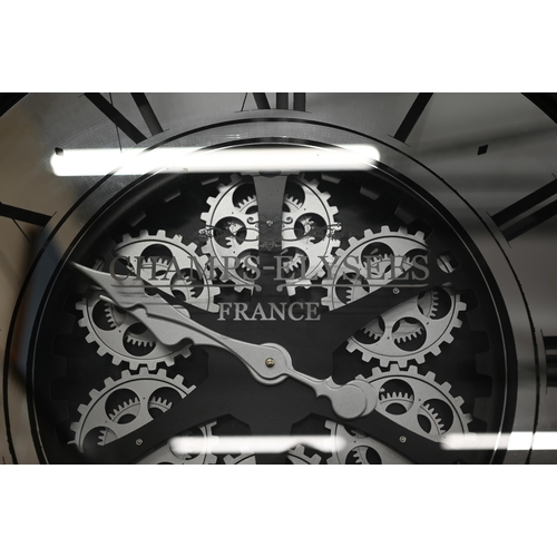 91 - A large mirrored 'Champs Elysees' design wall clock with black metal frame and quartz movement, 80 c... 