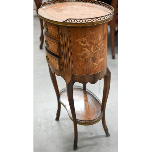 95 - A French kingwood and floral marquetry three drawer side table with pierced brass galleries on the t... 