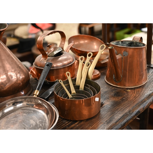 96 - An assortment of antique copper including kettle, measure, saucepans, etc to/w a riveted copper coal... 