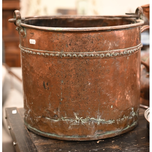 96 - An assortment of antique copper including kettle, measure, saucepans, etc to/w a riveted copper coal... 