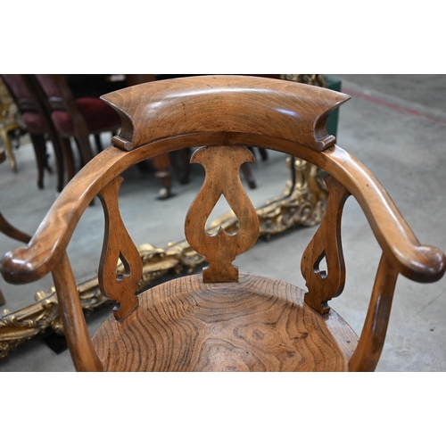 97 - An antique lyre back captain's swivel desk chair with shaped elm seat