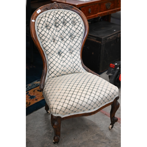 99 - A Victorian mahogany framed nursing chair upholstered ibn cream and blue lattice patterned fabric, t... 