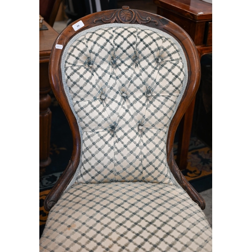 99 - A Victorian mahogany framed nursing chair upholstered ibn cream and blue lattice patterned fabric, t... 