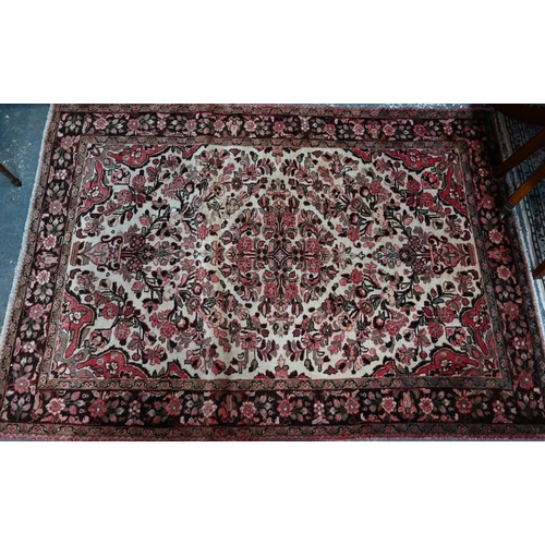 288 - A North West Persian Lilihan rug, traditional centre floral medallion design on soft rose ground, 21... 