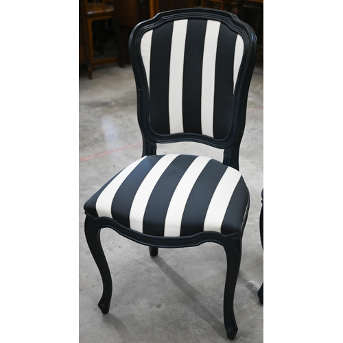 127 - Four modern side chairs with painted frames, the backs and seats upholstered in blue/cream striped f... 