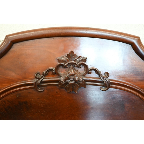 141 - A Victorian carved mahogany double bed headboard with barleytwist pillars, 152 cm wide (5ft)