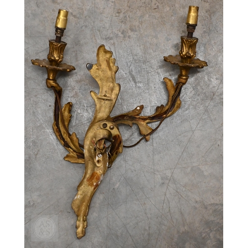 277 - A pair of Rococo style gilt metal twin branch asymmetric design wall sconces, 45 cm h